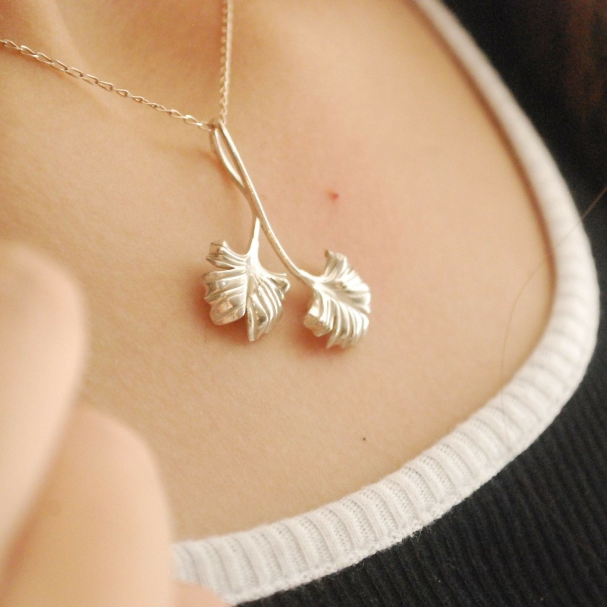 Intricate ginkgo leaf pendant reflecting nature's strength and serenity