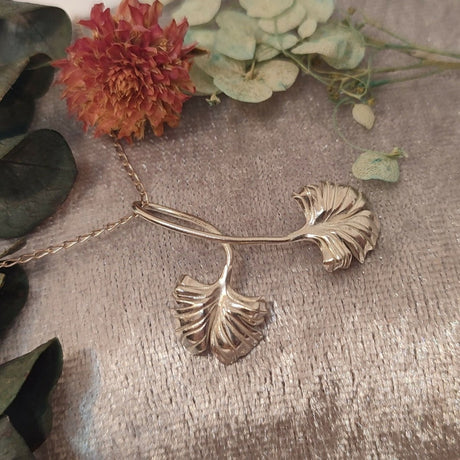 Elegant pendant featuring a ginkgo leaf design for hope and renewal