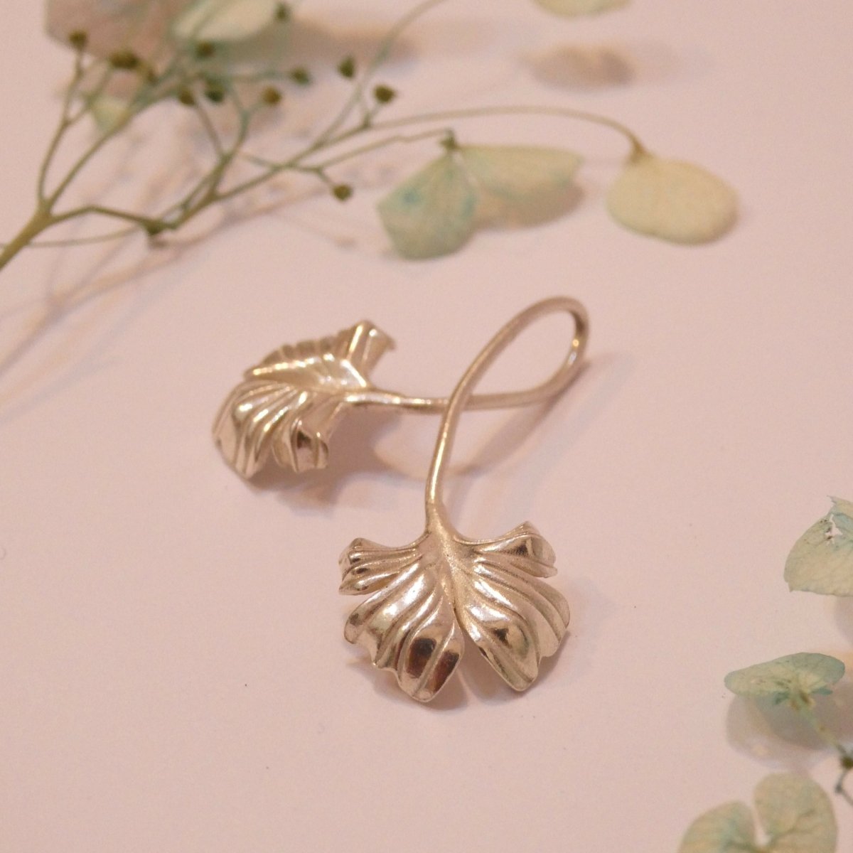 Delicate ginkgo leaf-inspired necklace symbolizing resilience and growth