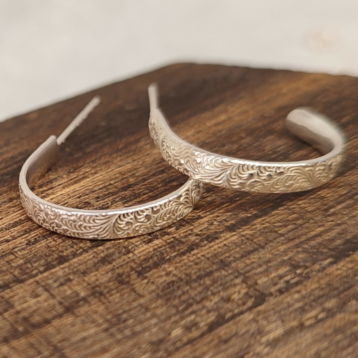 Artisan-crafted large hoop earrings featuring geometric patterns